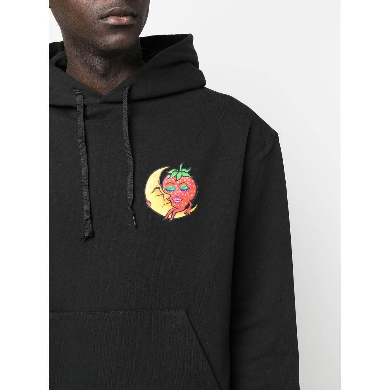Sky High Farm Workwear black hoodie with chest graphic print, featuring a drawstring hood and patch pocket, made of organic and recycled cotton.