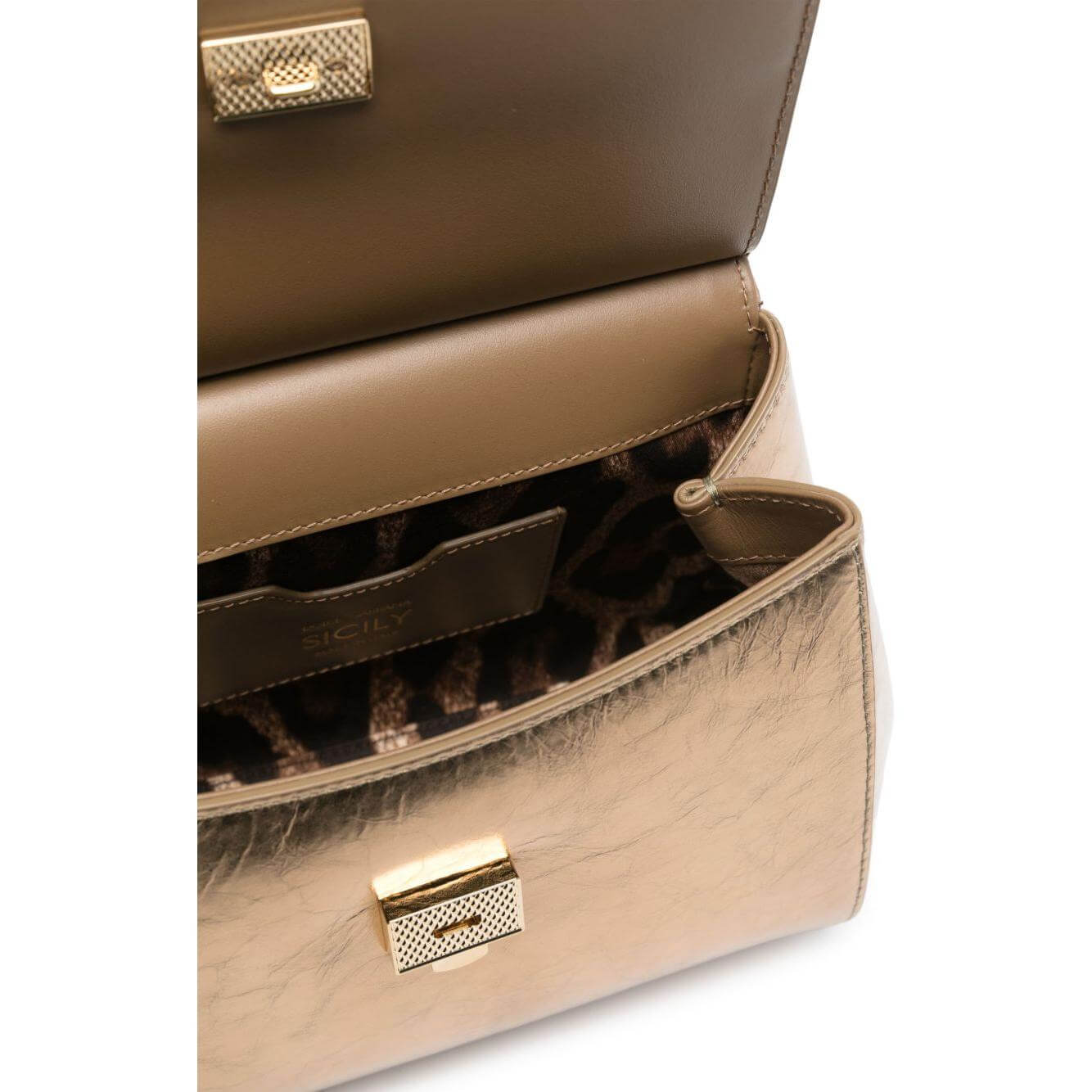 Open Dolce & Gabbana Sicily metallic leather tote bag with gold-tone buckle and leopard print interior view.