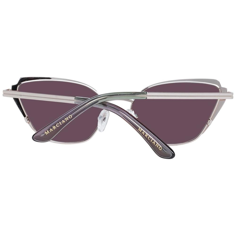 Marciano by Guess gold cat eye sunglasses with brown gradient lenses and full-rim metal & plastic frame, 100% UVA & UVB protection.