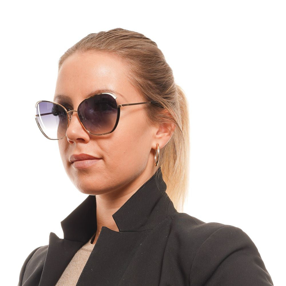 Woman wearing Emilio Pucci gold butterfly sunglasses with grey mirrored gradient lenses, metal full-rim frame, and branded case.