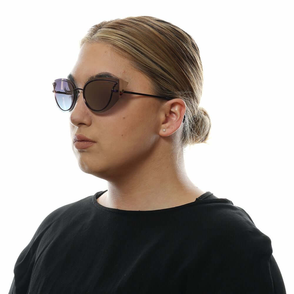 Woman wearing Police Purple Cat Eye Sunglasses with Blue Lenses, featuring Metal & Plastic frame and 100% UVA & UVB protection.