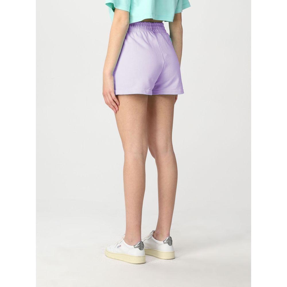 Model wearing Pharmacy Industry purple cotton shorts, showcasing back design with logo. Made in Italy. Perfect for chic casual style.