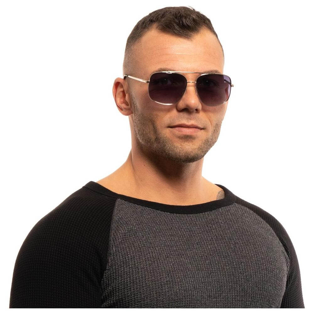 Man wearing Guess Silver Aviator Sunglasses with Gradient Grey Lenses and Metal Frame, highlighting stylish eyewear design.