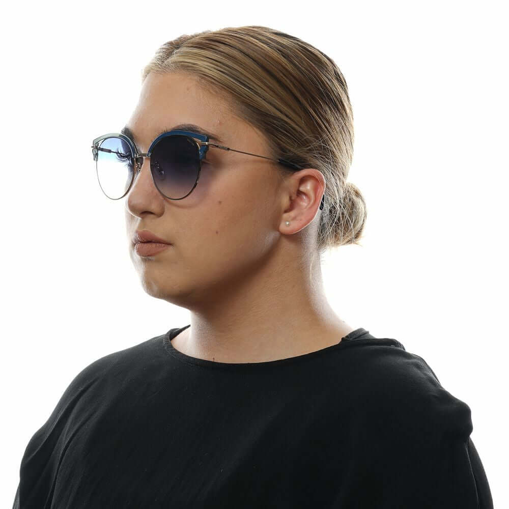 Woman wearing Police Blue Butterfly Sunglasses with gradient lenses, metal and plastic frame, offering 100% UVA & UVB protection.