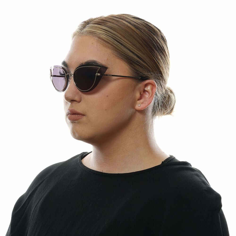Alt Tag: Woman wearing rose gold cat eye sunglasses with grey lenses, showcasing a stylish design. Perfect for 100% UVA & UVB protection.