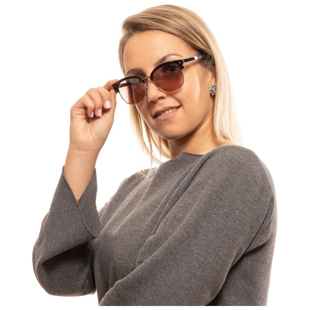 Woman wearing Bally Brown Unisex Sunglasses with mirrored rose lenses and brown full-rim frame, stylish and UV protected.