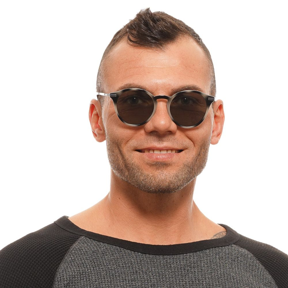 Man wearing Ted Baker Gray Men's Sunglasses with round mirrored lenses and full-rim style.