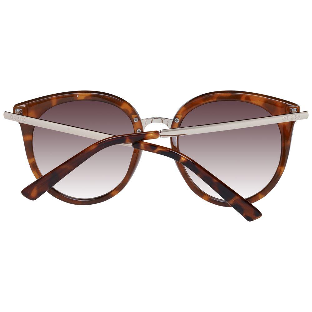 Guess brown women's round sunglasses with gradient lenses and plastic full-rim frame, featuring branded case.