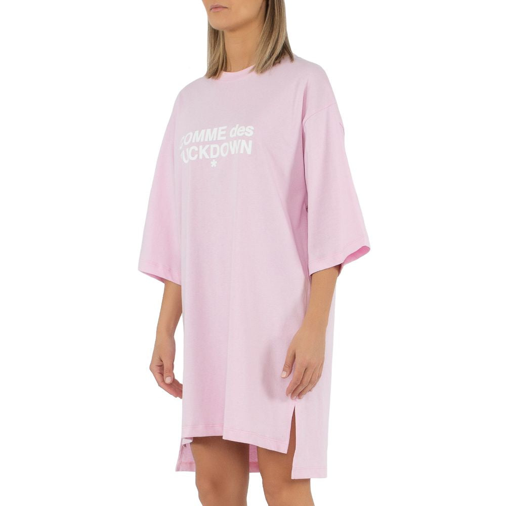 Comme des Fuckdown pink cotton oversized t-shirt dress with chest logo print, side slits, and short sleeves