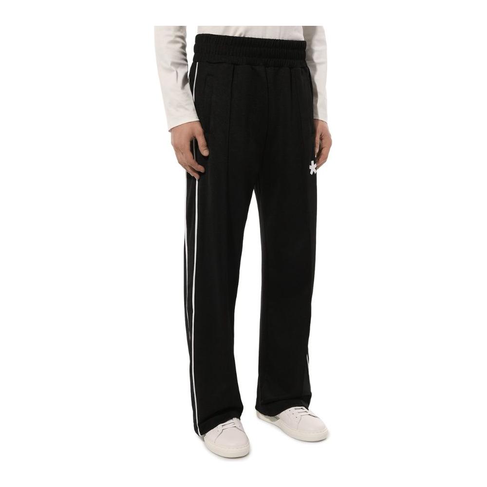 Comme des Fuckdown black polyester tracksuit trousers with logo print, white side bands, and side pockets.