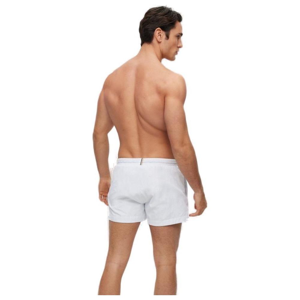 Men's Hugo Boss white polyamide swim shorts, Fall/Winter collection, rear view showcasing design and fit.