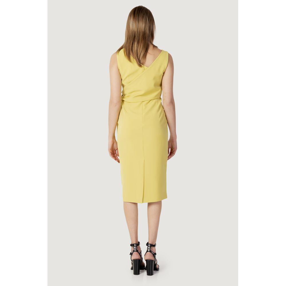 Rear view of woman wearing Sandro Ferrone yellow polyester dress, spring/summer collection, highlighting back design and color.