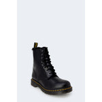 Dr. Martens Black Leather Boot with rubber sole and lace-up closure, offering style and comfort in iconic design.