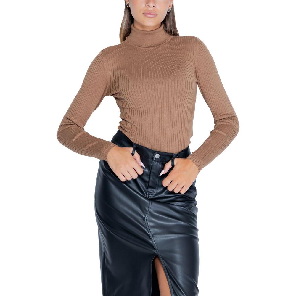 Alt Tag: Woman wearing Jacqueline De Yong brown viscose knit top, fall/winter collection, paired with black leather skirt