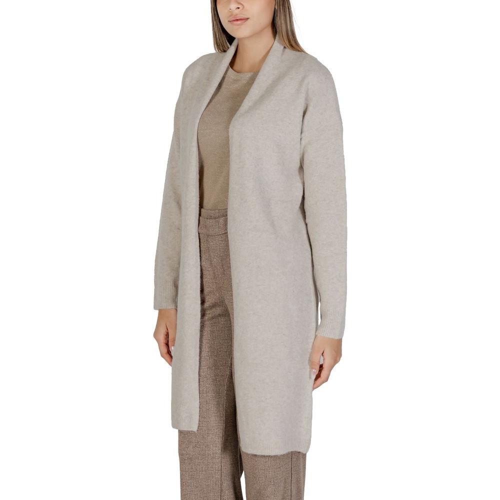Woman wearing Morgan De Toi beige polyester cardigan, part of women's knitwear fall/winter collection with blended fabrics.