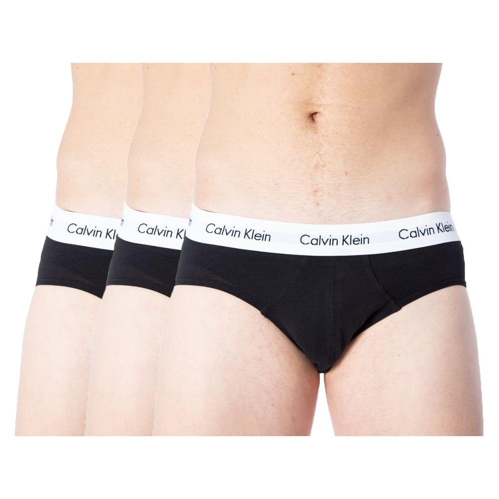 Three Calvin Klein black cotton men's briefs with logo waistband, showcasing comfort and style.