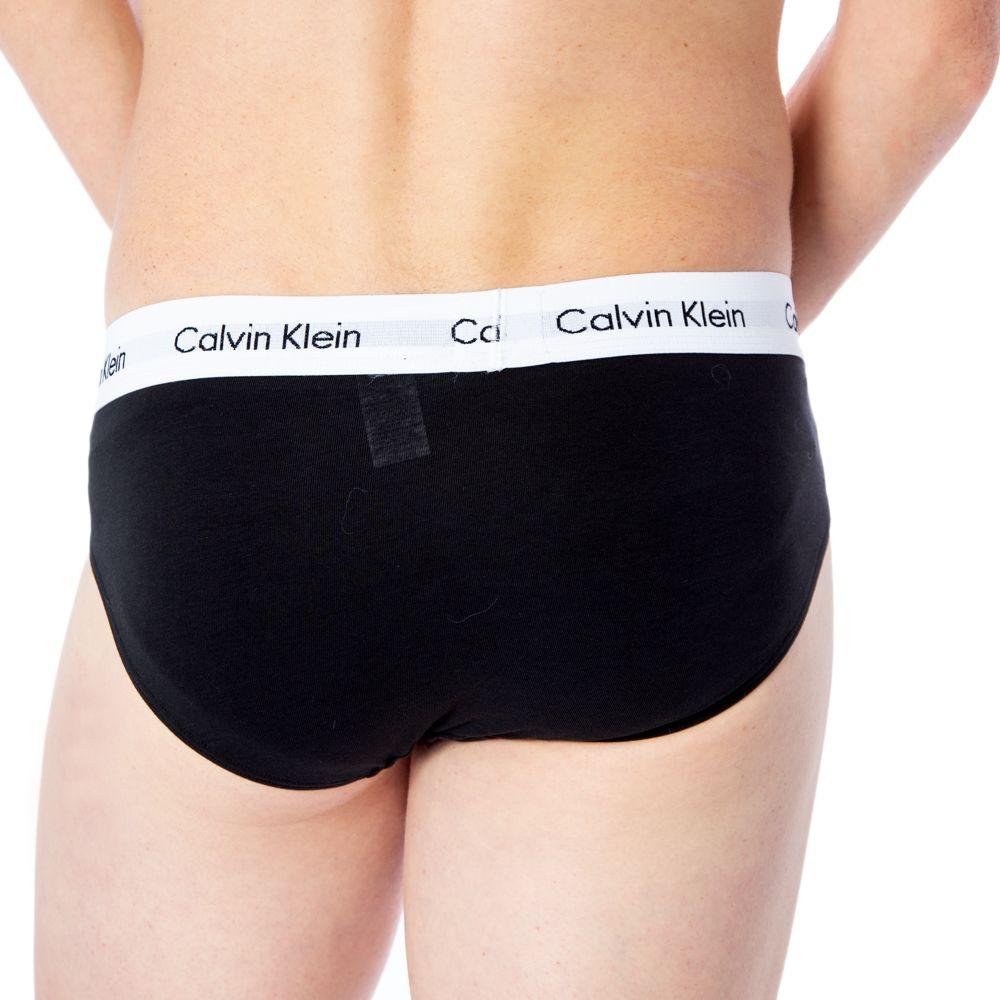 Calvin Klein black cotton men's brief with elastic waistband and logo, side view, providing comfort and stylish daily wear.