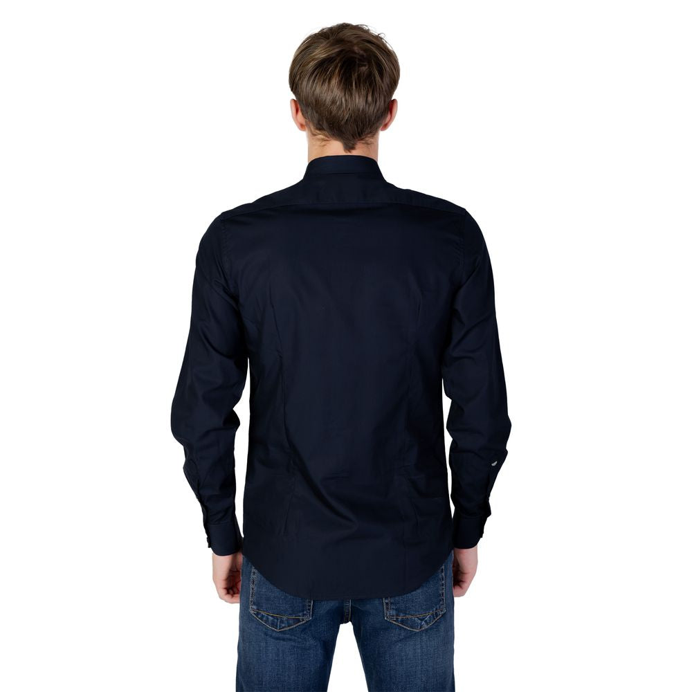 Back view of Antony Morato blue cotton shirt, long-sleeve design, paired with jeans, showcasing elegant style.