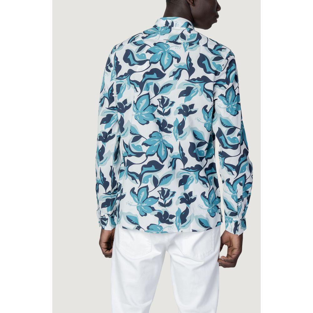 Back view of Antony Morato blue viscose shirt with floral print, worn by a male model in white trousers.