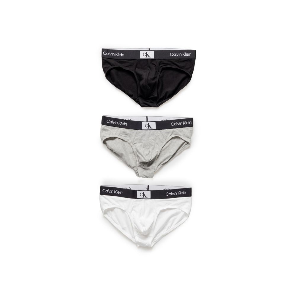 Calvin Klein men's 3-pack HIP BRIEF underwear, black, grey, white. 100% cotton, ergonomic design, elastic waistband with logo.