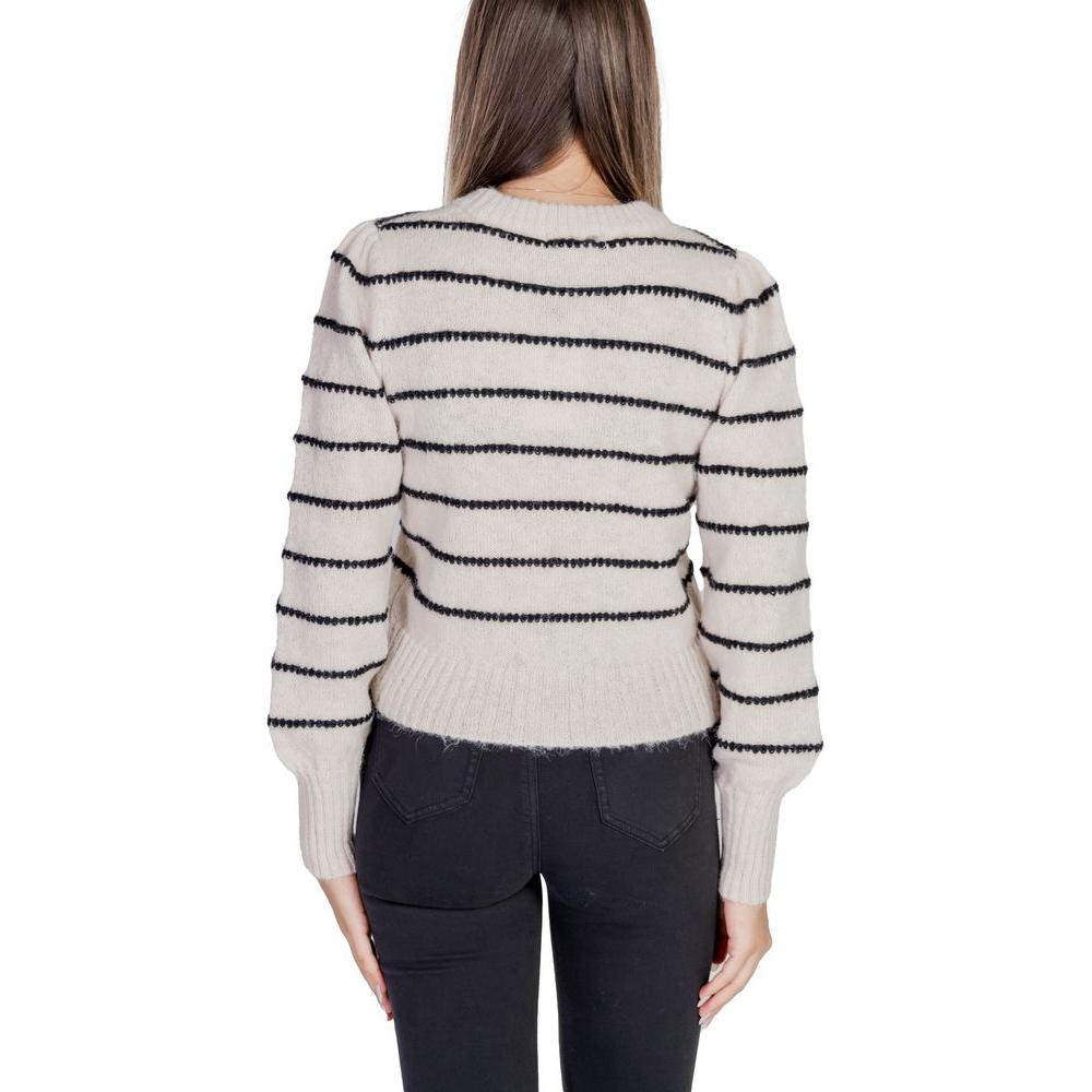 Back view of woman wearing Jacqueline De Yong gray polyester sweater with black stripes, part of autumn/winter collection.