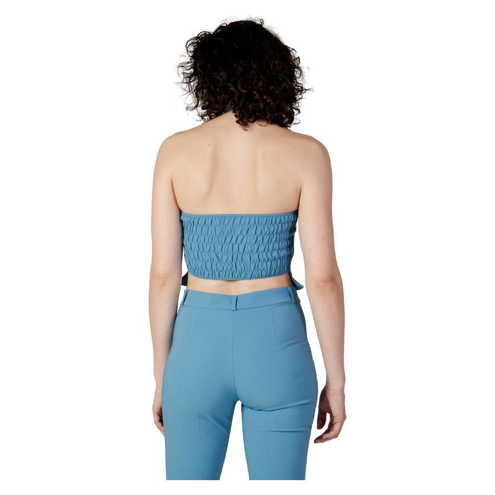 Back view of model wearing Rinascimento Turquoise Polyester Top, part of Autumn/Winter collection, made of 88% polyester and 12% elastane.