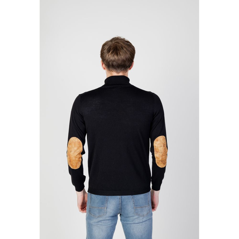 Back view of a man wearing an Alviero Martini Prima Classe black viscose turtleneck sweater with leather elbow patches, fall/winter style.