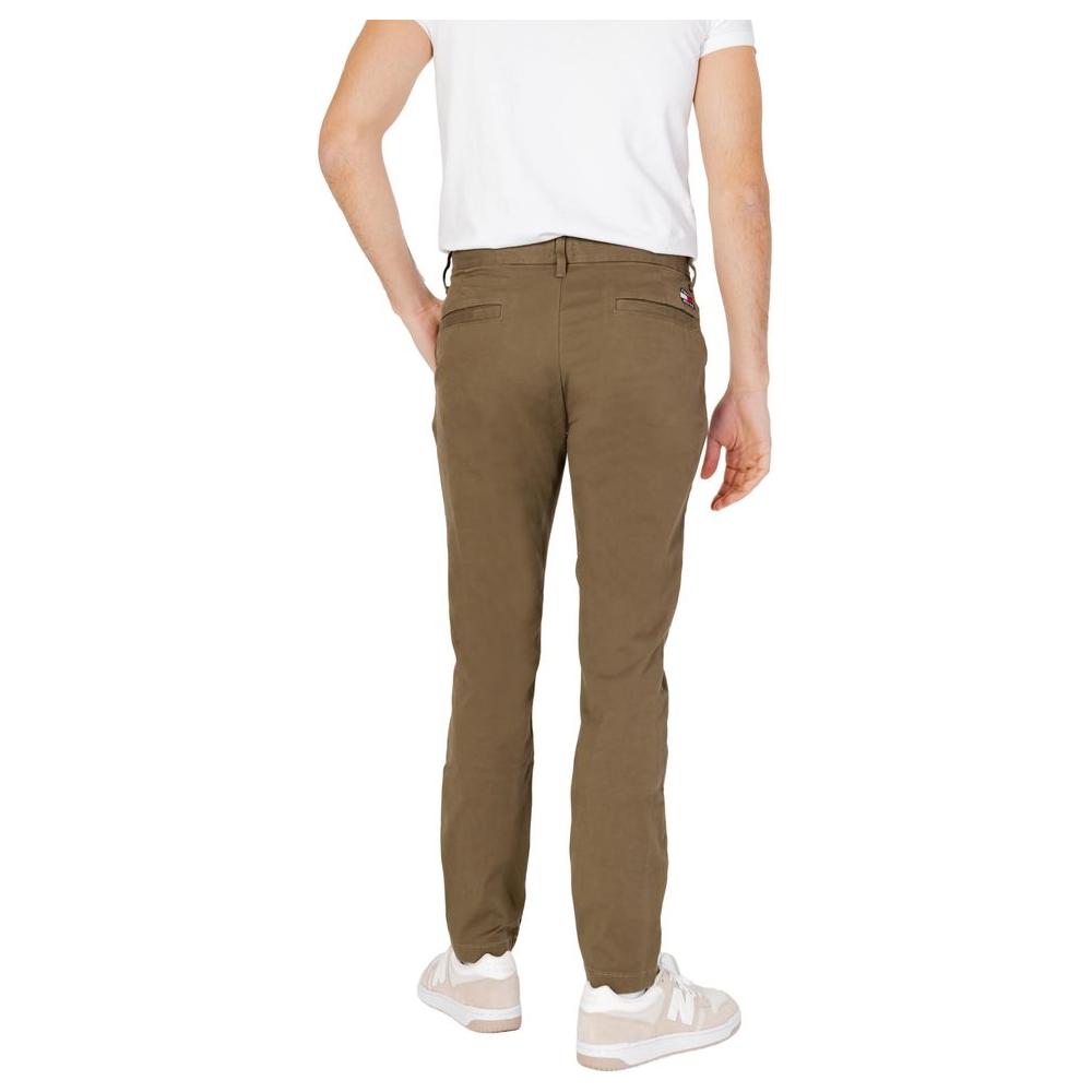 Men's green Tommy Hilfiger tapered pants made from 96% organic cotton, 4% elastane; perfect for spring summer fashion.