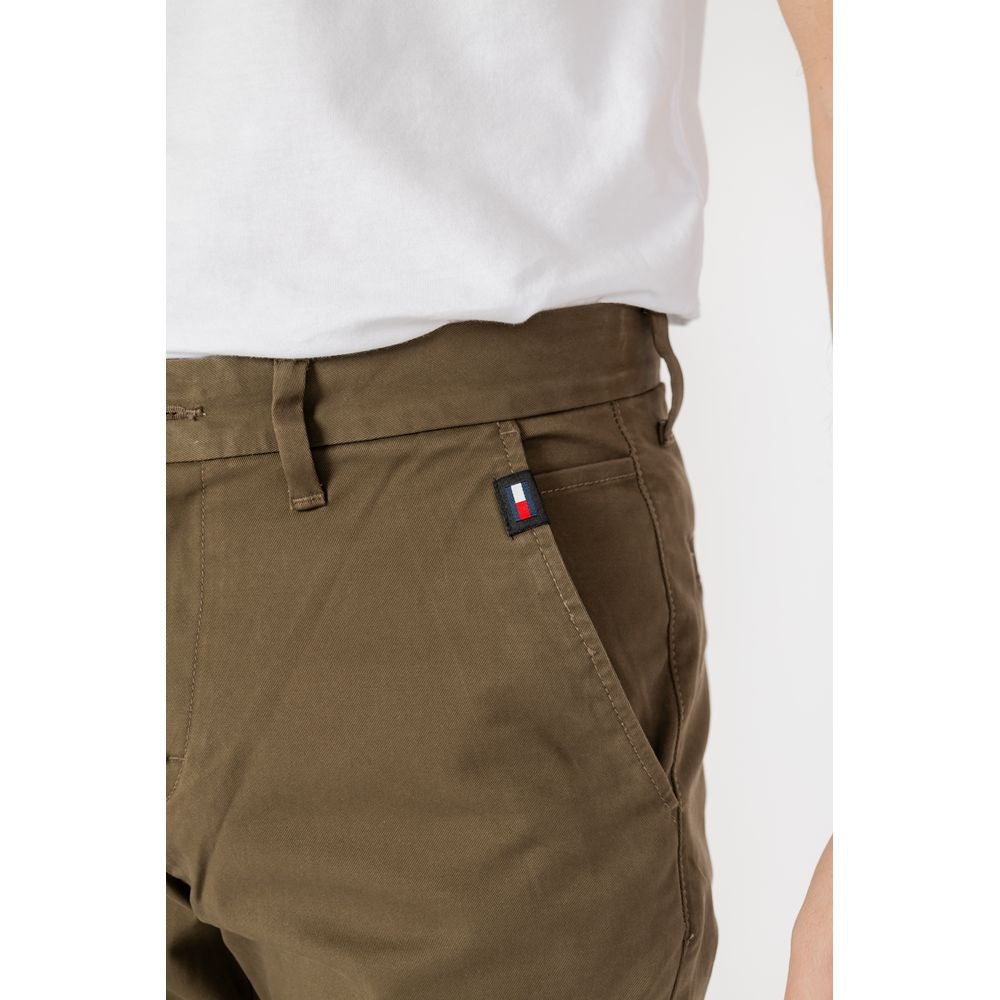 Close-up of Tommy Hilfiger men's green tapered organic cotton jeans for spring/summer collection