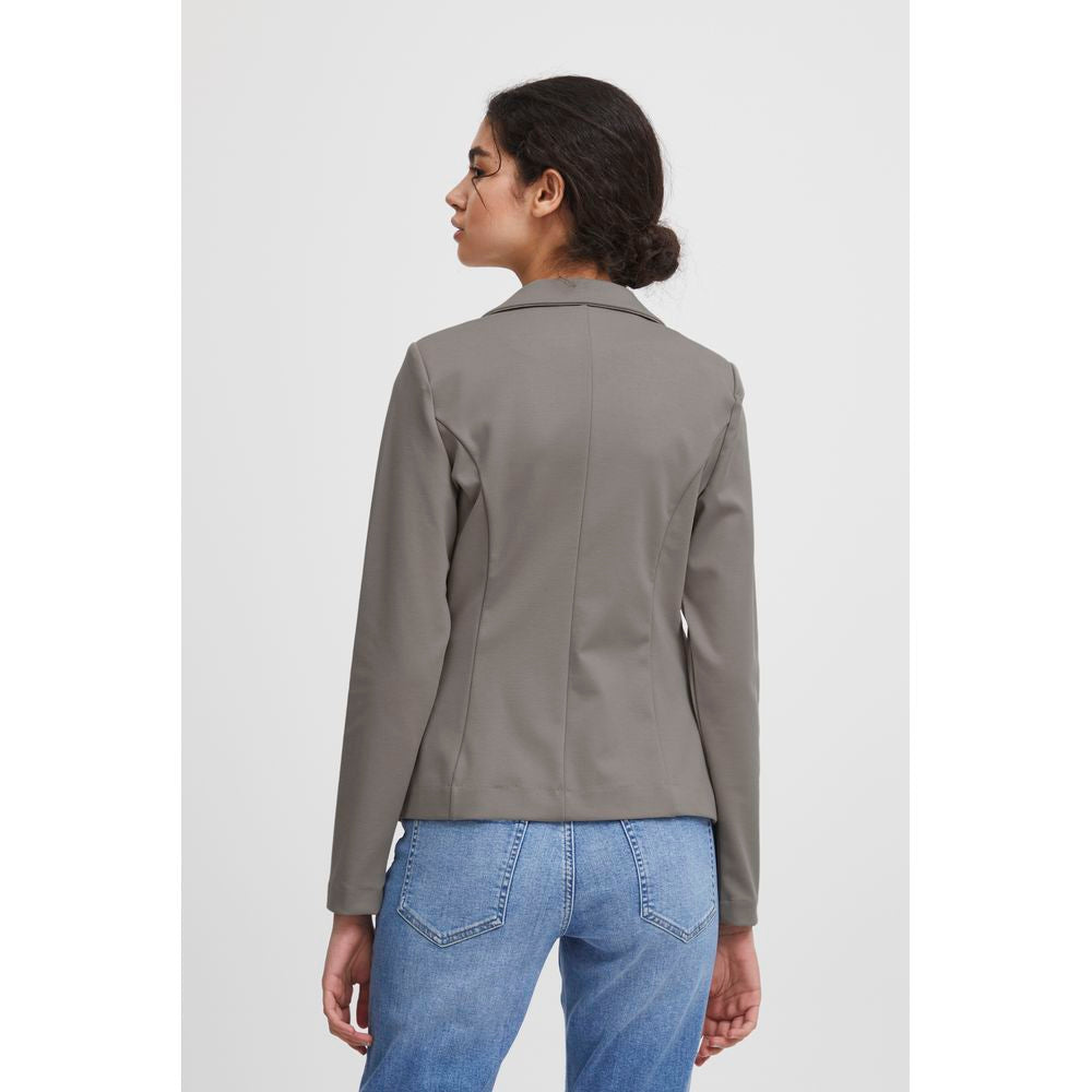 Back view of a woman wearing an ICHI gray polyester blazer from the Fall/Winter collection, paired with blue jeans.