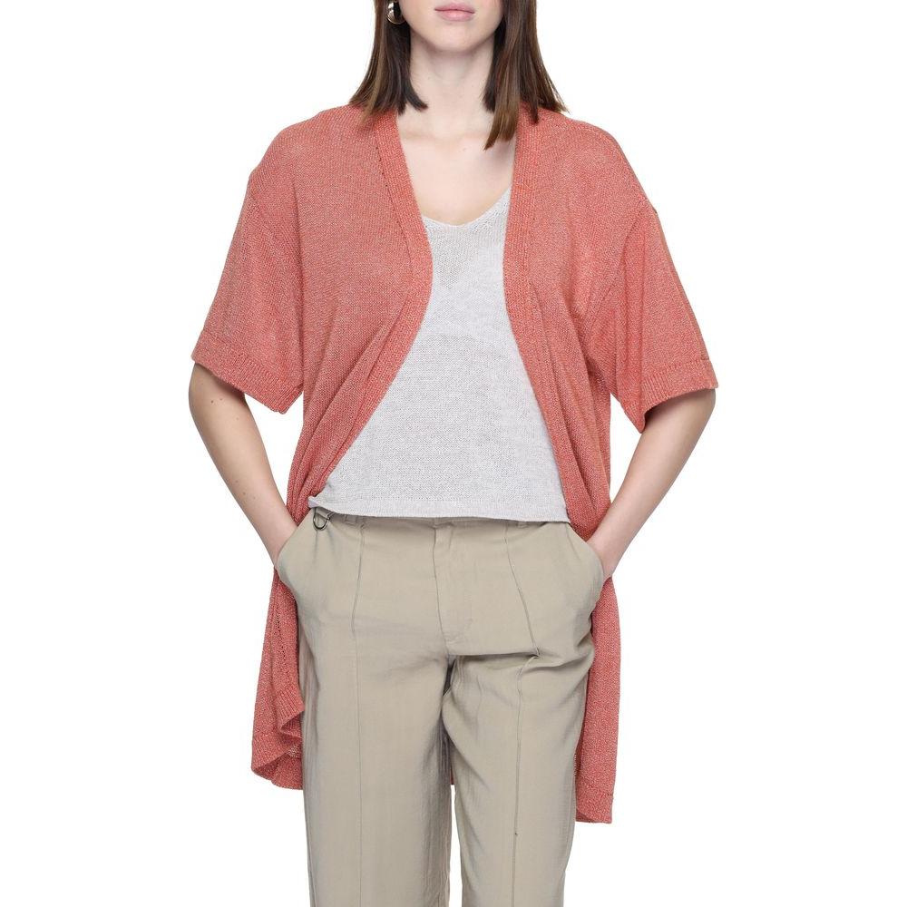 Jacqueline De Yong red recycled cotton cardigan, short-sleeved, lightweight for spring/summer, worn over a neutral outfit.
