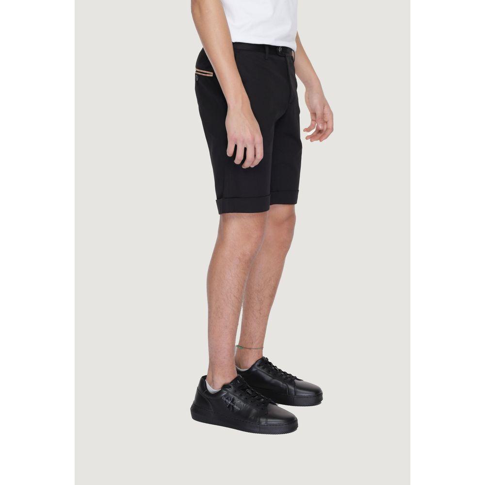 Alviero Martini Prima Classe black cotton men's Bermuda shorts, spring/summer collection, side view with black sneakers.