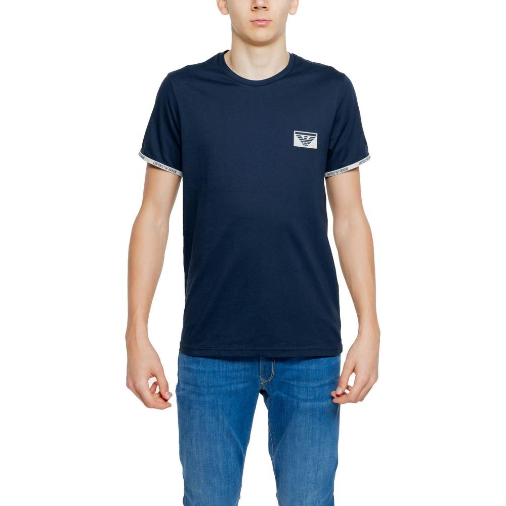 Man wearing Emporio Armani blue cotton t-shirt, short-sleeve, modern design, front logo visible, ideal for daily and casual wear.