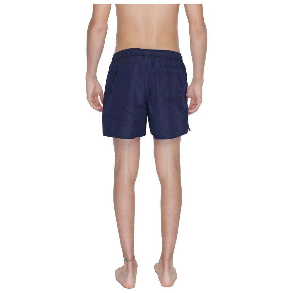 Back view of Emporio Armani blue polyester men's boxer swimsuit, featuring regular fit and stylish design for beach and pool days.