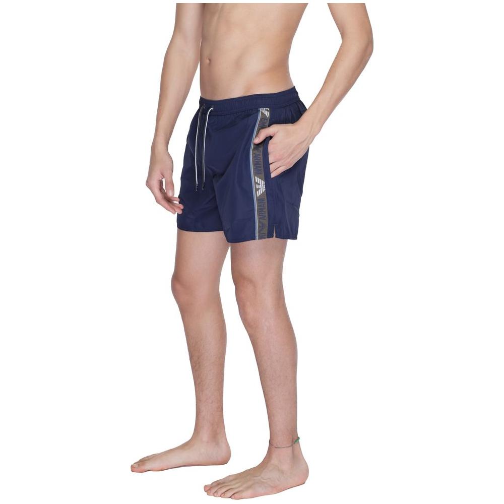 Emporio Armani Underwear men's blue polyester boxer swimsuit, model 211740 4R443, with elegant fit and brand details.