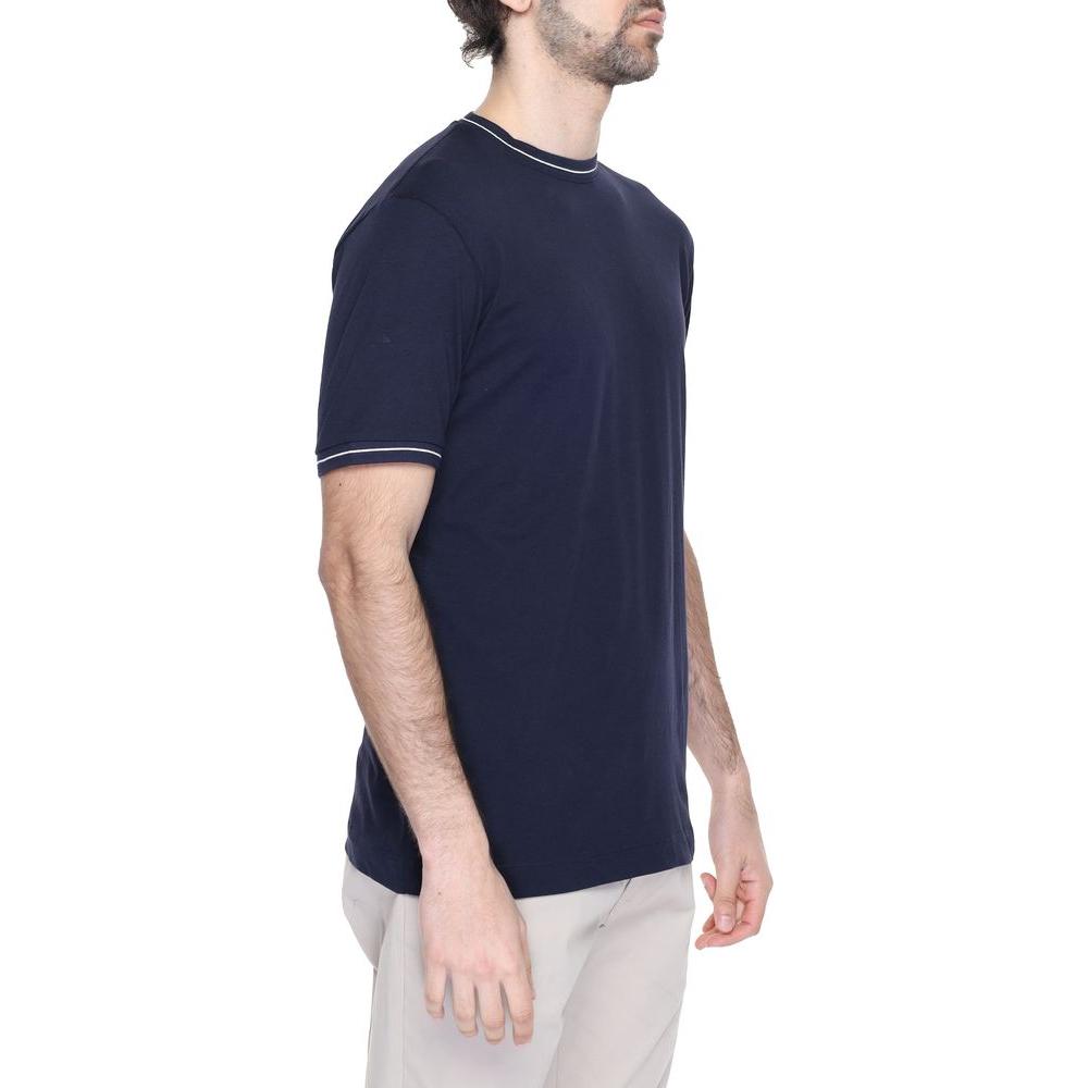 Man wearing a Hamaki-Ho blue cotton T-shirt from the Spring/Summer collection, showcasing 100% cotton quality.