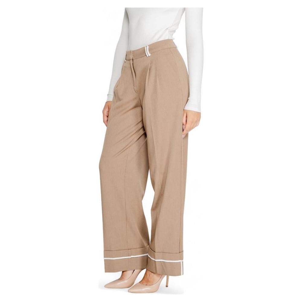 Women's brown recycled polyester pants for fall/winter collection, featuring a comfortable fit and stylish design.