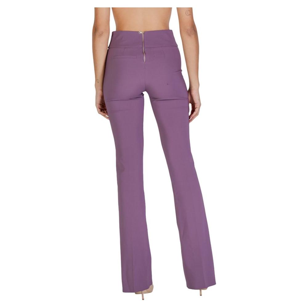Back view of women's Sandro Ferrone purple polyester jeans and pants, Fall/Winter collection, showcasing zipper detail and flared style.