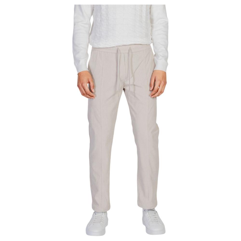 Antony Morato beige polyester jeans and pants for men, fall/winter collection, stylish fit with white sneakers.