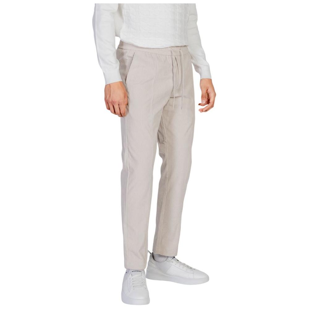 Antony Morato beige polyester pants for men from fall/winter collection, styled with white sneakers, perfect for casual wear.