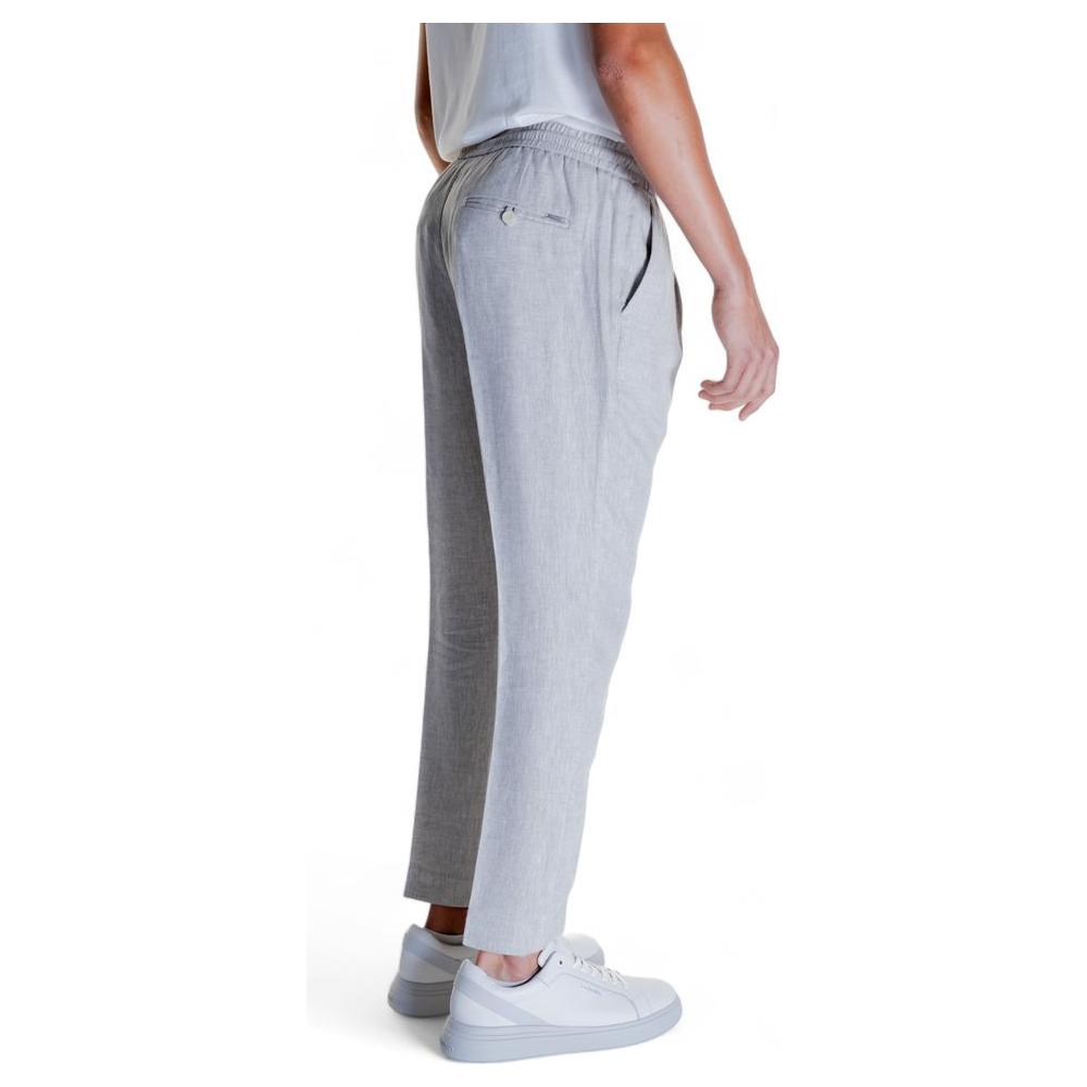 Side view of Antony Morato beige linen pants, featuring a blend of 54% linen and 46% viscose, ideal for men's wardrobes.