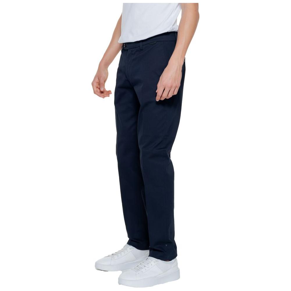 Men's slim blue trousers by Antony Morato, spring/summer collection, 98% cotton, 2% elastane, styled with white sneakers.