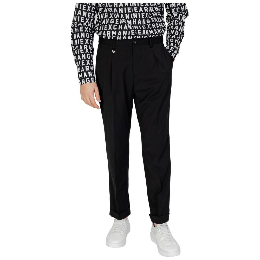 Man wearing Antony Morato black polyester jeans and pants with casual shirt and white sneakers, spring/summer collection.