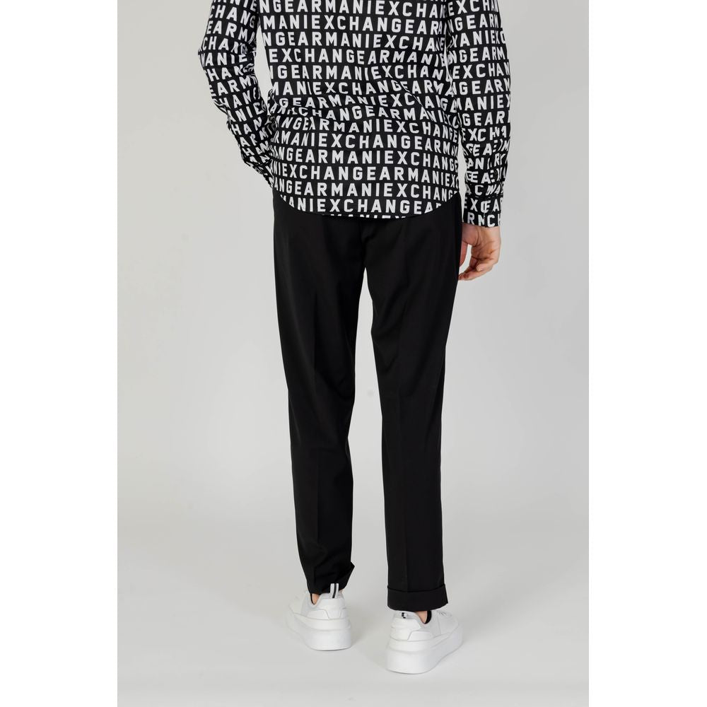 Back view of a person wearing Antony Morato black polyester pants from spring/summer collection, featuring a logo-print top.