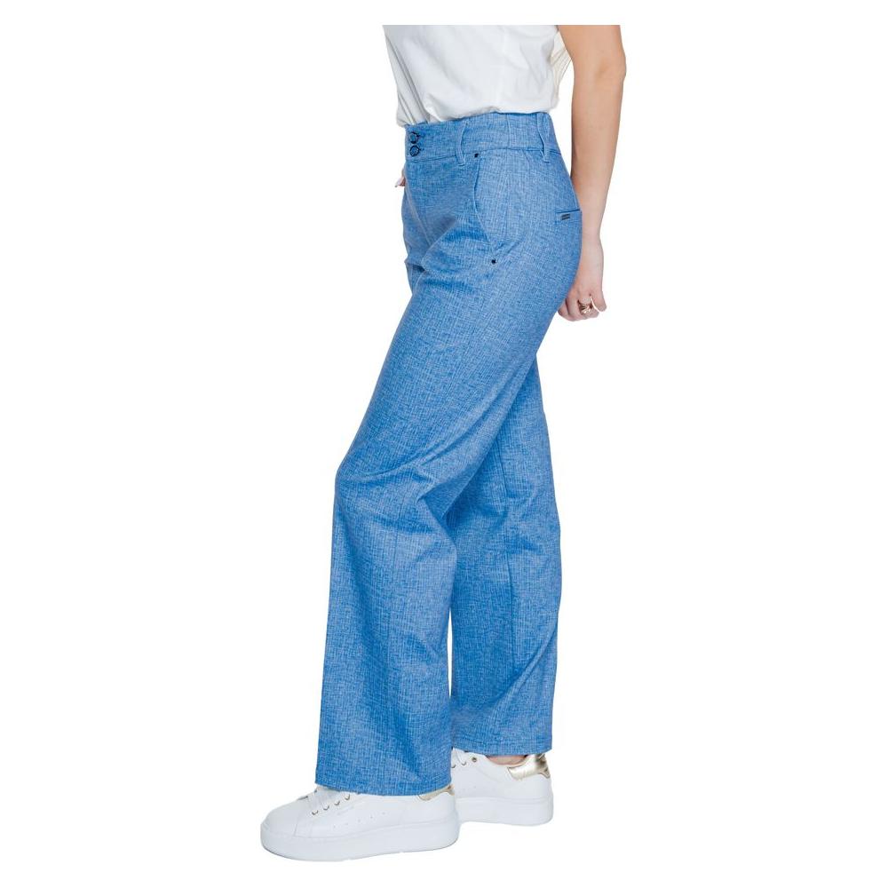 Women's blue palazzo pants by Street One, made of polyester blend; perfect for spring/summer fashion. Side view on a model in white sneakers.