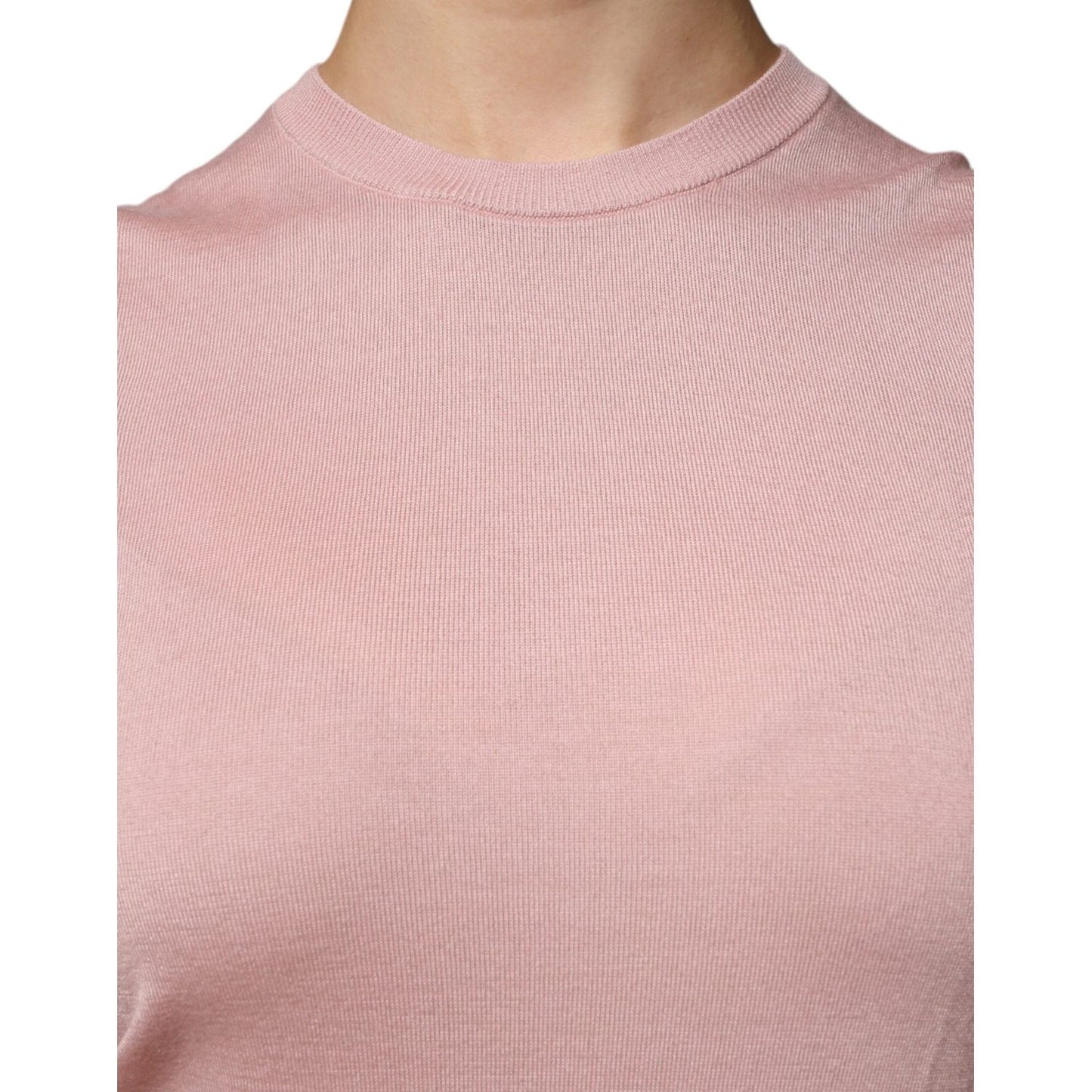 Dolce & Gabbana pink cashmere sleeveless tank top with logo detail, made in Italy, showcasing exclusive craftsmanship.