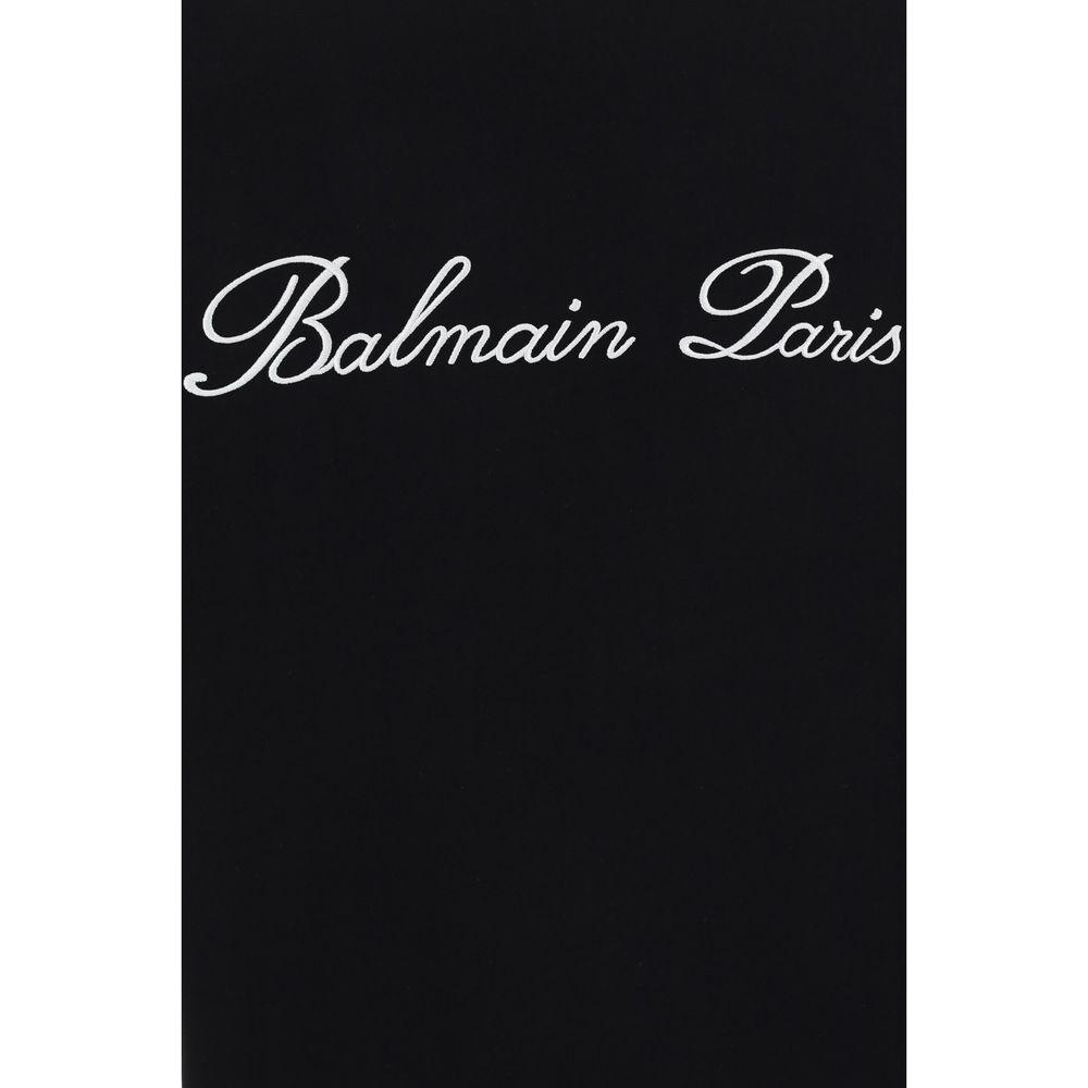Black Balmain T-Shirt with white 'Balmain Paris' logo, ribbed crew neck and monochrome pattern, showcasing luxury fashion style.