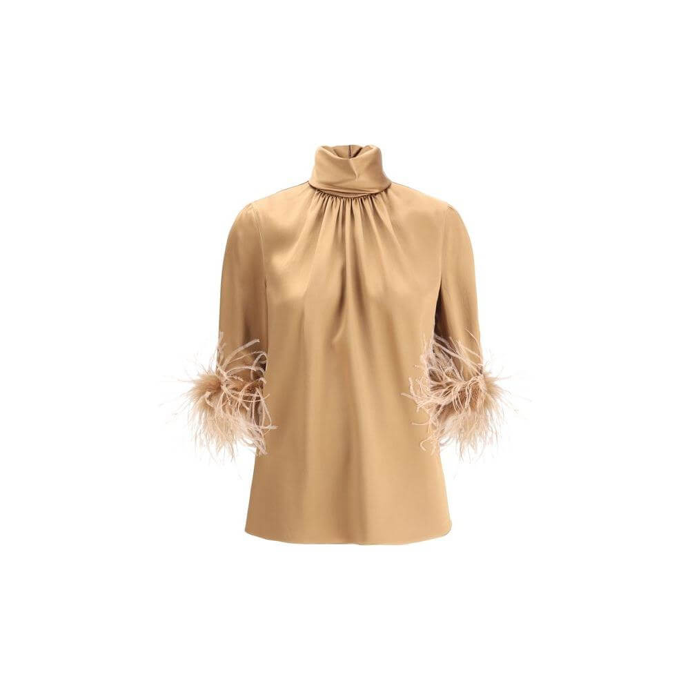 Dolce & Gabbana tan blouse with high neck, 3/4 sleeves, and feather trim, showcasing elegance and luxury. Back zipper adds a perfect fit.