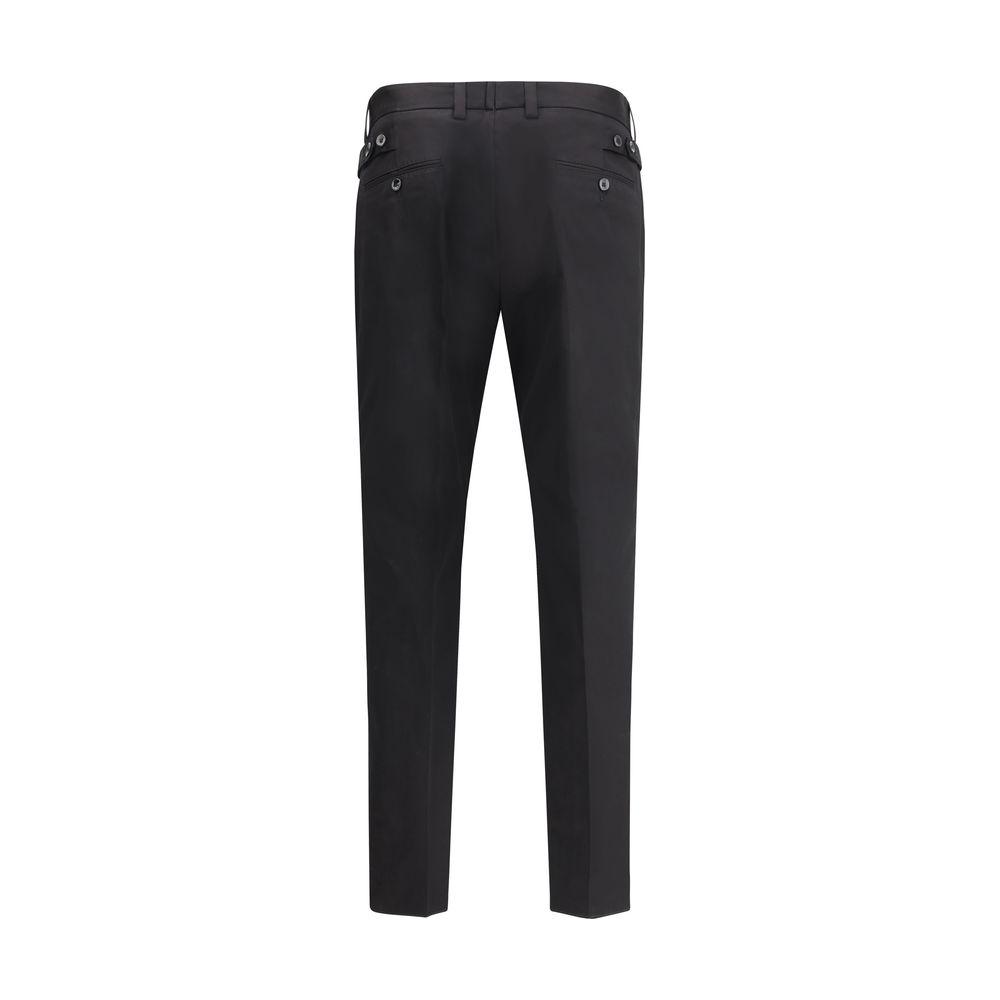 Dolce & Gabbana black cotton pants, mid-rise with front button, zipper closure, side slash pockets, welt back pockets, and waistband loops.