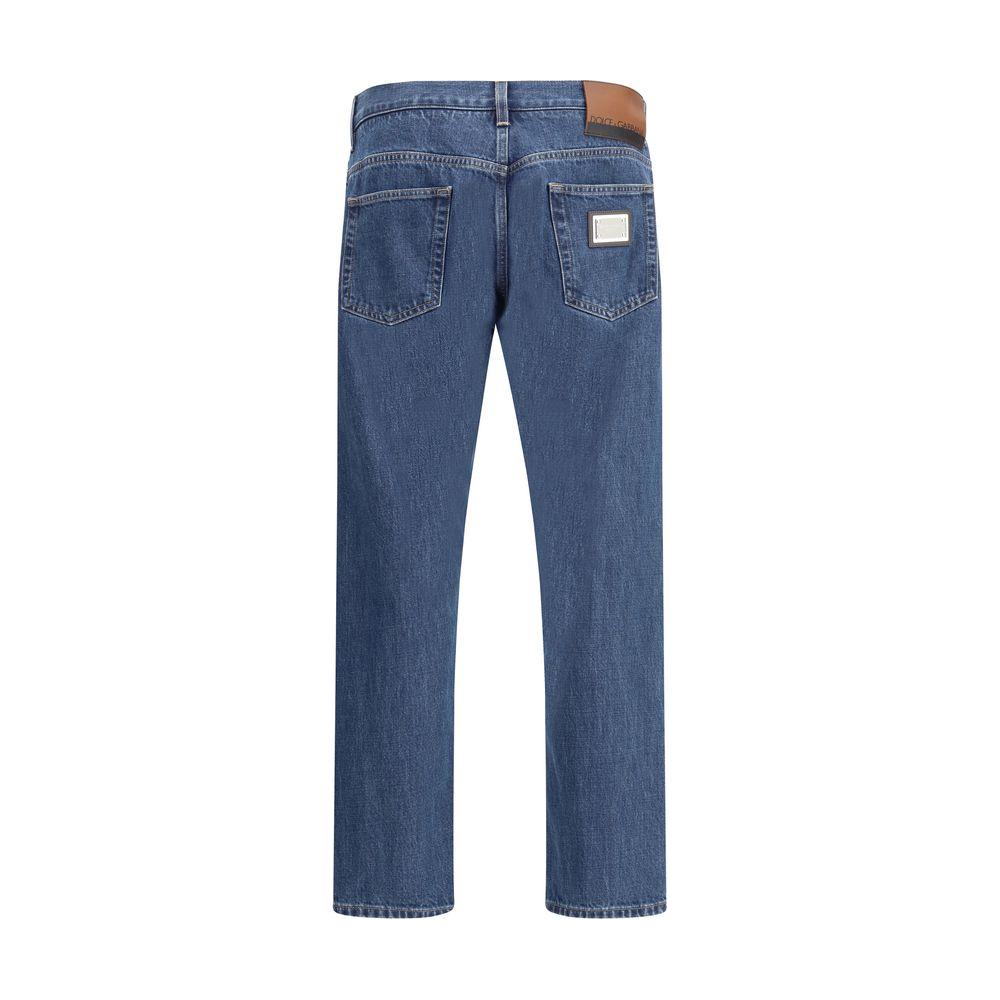 Back view of Dolce & Gabbana blue straight jeans with logoed metal plaque, featuring a mid-rise and five-pocket design.